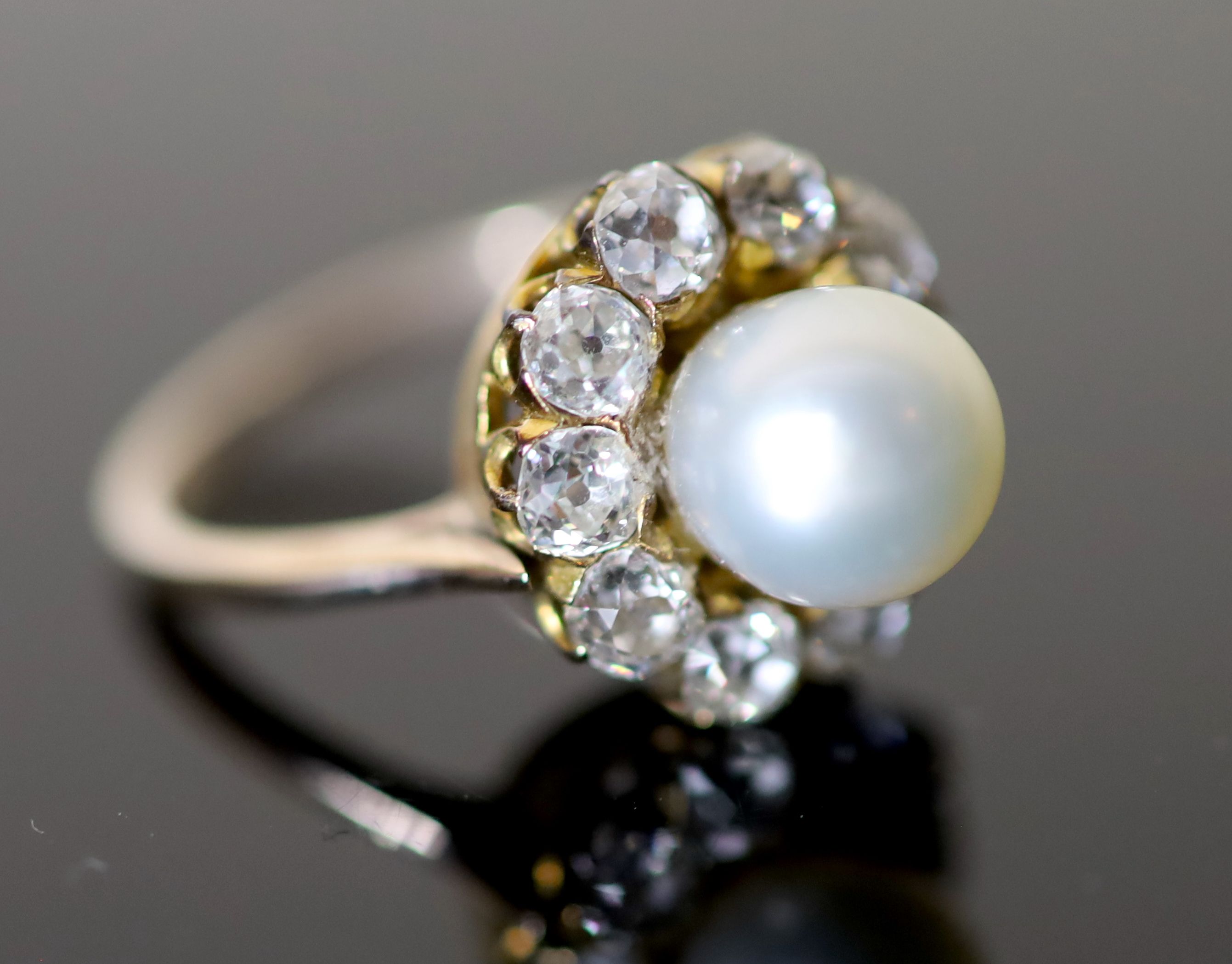 A modern gold, cultured pearl and diamond set circular cluster ring,